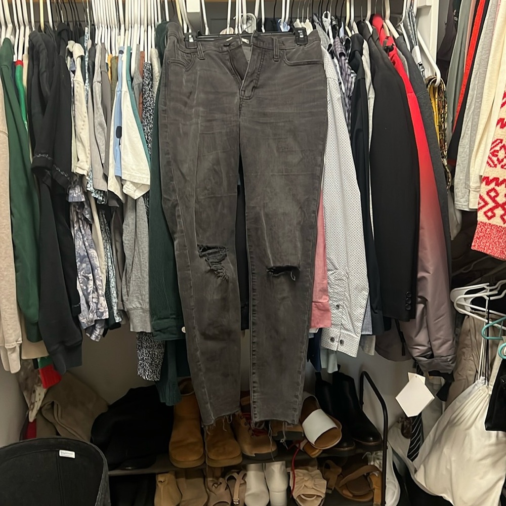 Madewell light black skinny jeans with ripped knees and frayed ankles